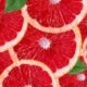 Grapefruit slices with green leaves - Fruits
