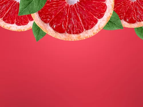 Grapefruit slices on the upper side background