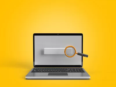 Laptop with search bar and magnifying glass
