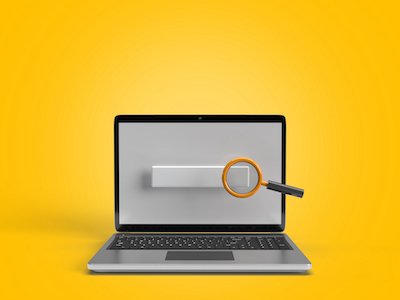 Laptop with search bar and magnifying glass