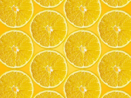 Orange slices on orange background
