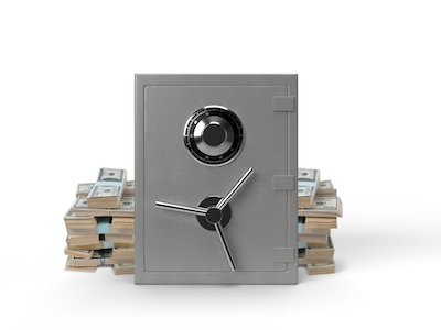 3D silver closed safe front view with stacks of money on white background.
