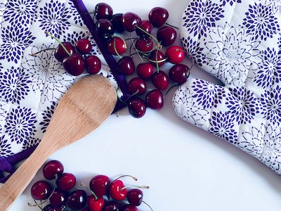 Cherries with wooden spoon