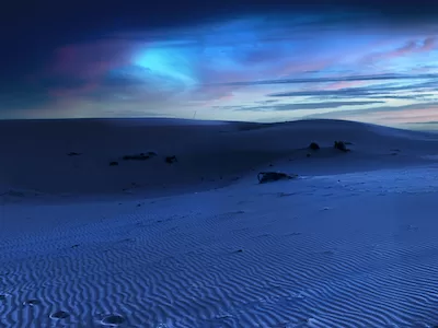 Sand dunes in the desert at night with beautiful sky looking stock image - Royalty Free