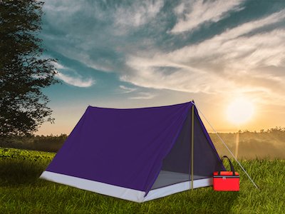 Purple camping tent with red lunch bag on grass background.