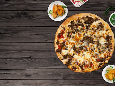 Pizza top view on wooden background
