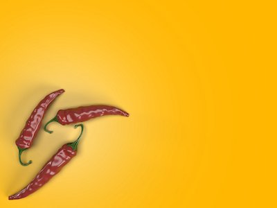 Red chilies on orange background