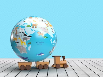 Earth globe for kids with kids train toy on wooden background.