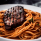 Grilled steak with spaghetti - Grilled steak with spaghetti stock image.