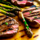 Grilled steaks with asparagus - Grilled steaks with asparagus stock image.﻿