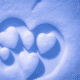 Snow hearts - Little white snow hearts stock image.