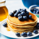 Pancakes with honey and blueberries - Pancake with honey and blueberries stock image.