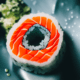 Sushi roll top view - Sushi roll with salmon top view stock image.