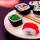 Sushi rolls on a plate - Sushi rolls with chopsticks stock image.