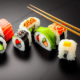 Sushi rolls with chopsticks - Sushi rolls pieces with chopsticks stock image.